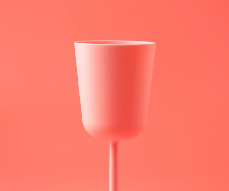 Wine glass on red background